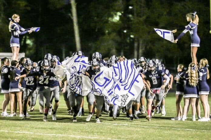 Friday night October 14, 2022 under the lights at Center, the Bears make their entrance for their Homecoming Game against Branford Buccaneers.