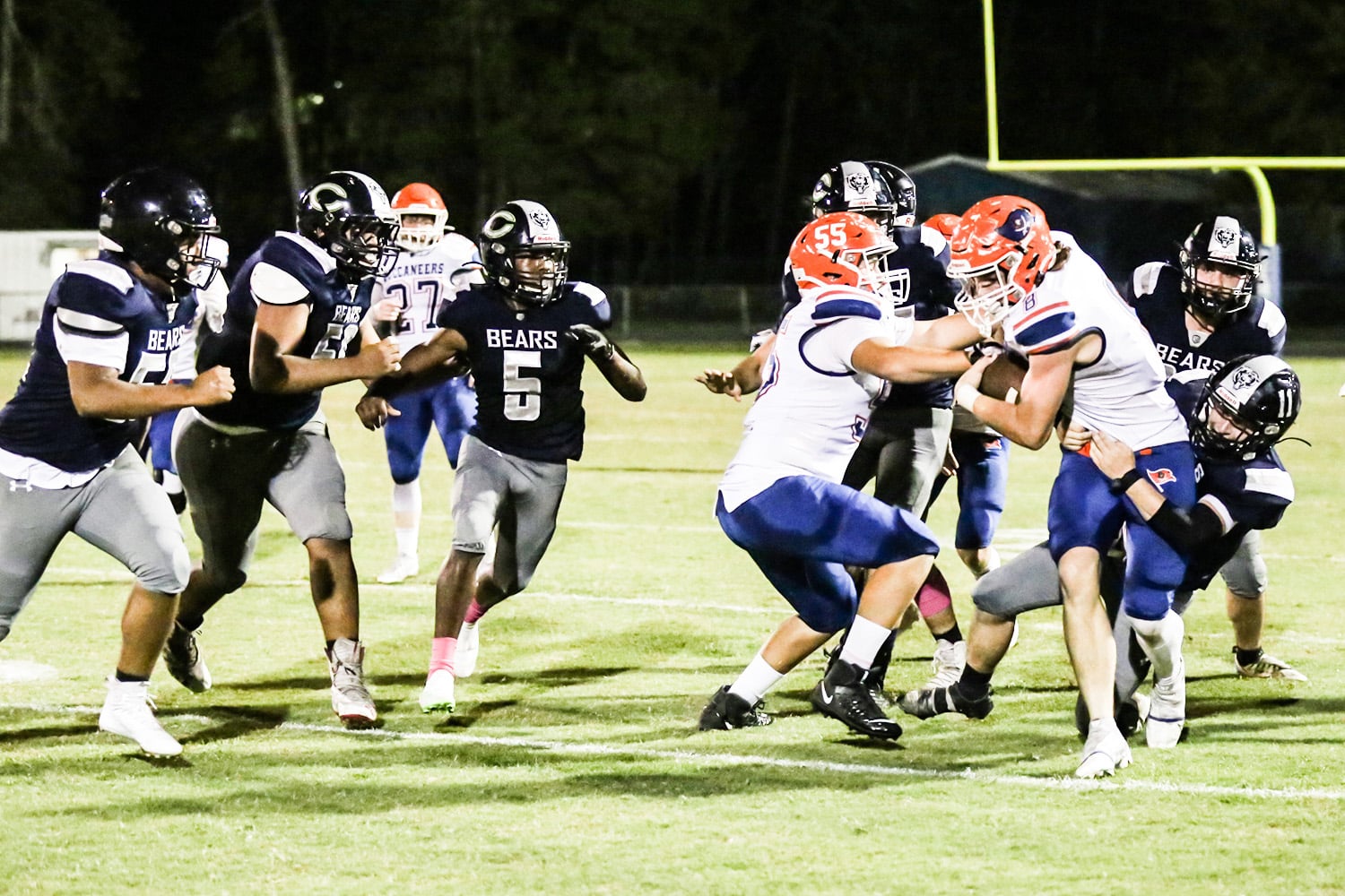 Bears No 11 Tyler Thorne (Fr) tackles Buccaneers No 8 Trevor Maddox Friday night's game, 10/14/22.