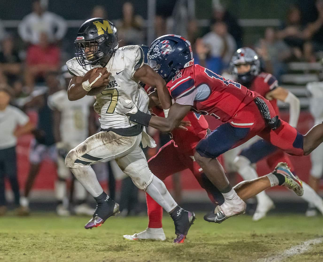 Springstead High, 12, Tyree Davis works to bring down Mitchell High, 7, Javarion Miller during the home playoff loss. Photo by JOE DiCRISTOFALO