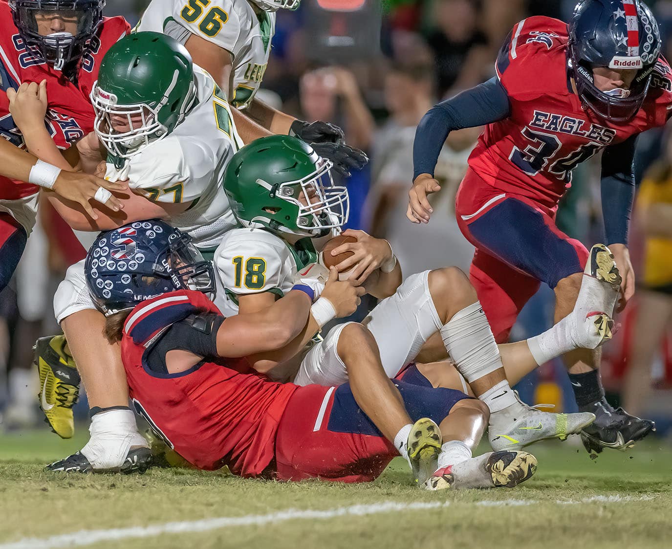 Eagle running back, 4, Connor Mccazzio rushes for a first down against the Lecanto defense. Photo by JOE DiCRISTOFALO