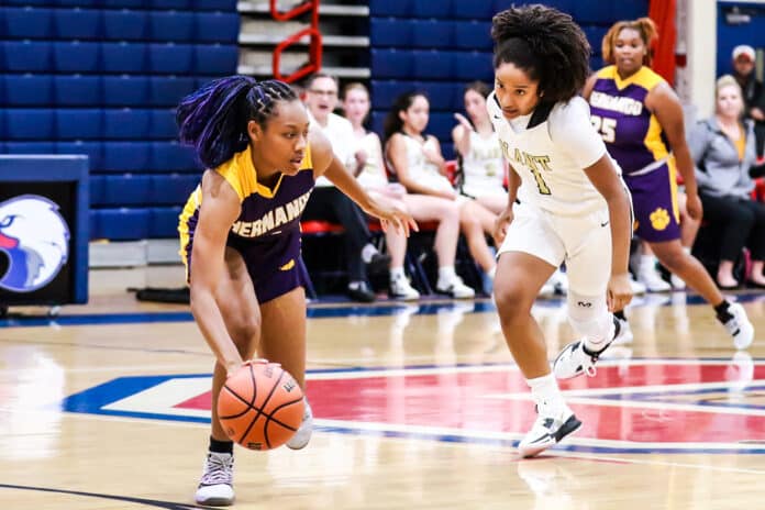 Leopards #4 Jr. Kayla Holloman drives the ball down the court Tuesday night Nov. 8 against Plant High School. Photo by Cheryl Clanton.