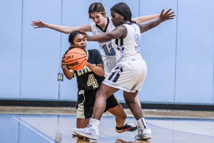 11/15/22 Nature Coast Sharks dominate the court, Shark 3 So. Praise Lawson and 12 Jr. Brooklynn Mulas are blocking Citrus from passing the ball. Photo by Cheryl Clanton.