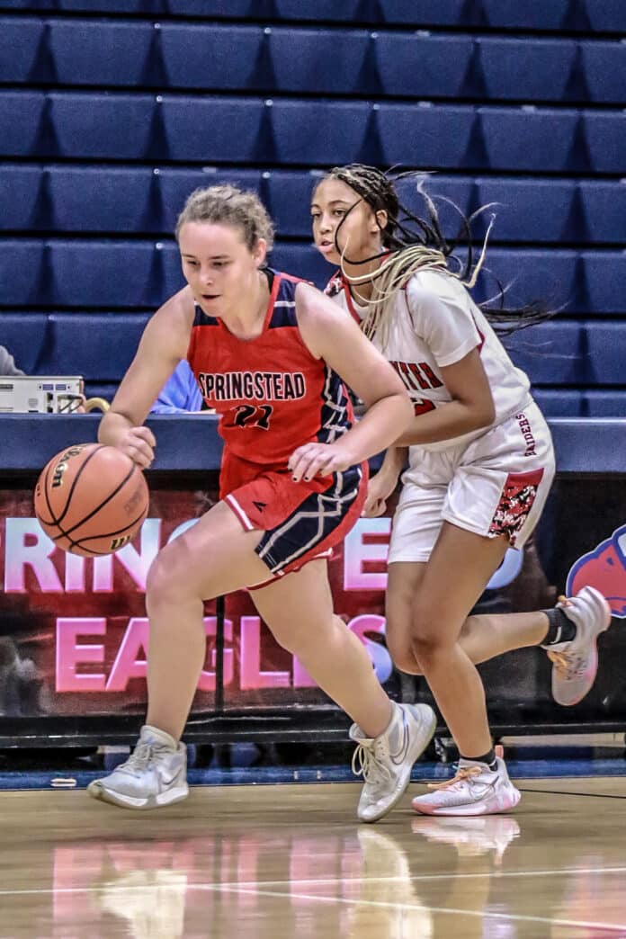 Springsteads #21 Jr. Lucy Waggoner dribbles back down the court in Tuesday nights game (Nov. 8). Photo by Cheryl Clanton.