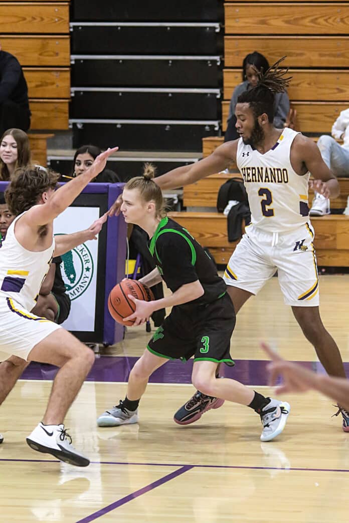 Tuesday night 12/13/22 Hornet Sr. #3 Adian Smith play defense move against the Leopards. Photos by Cheryl Clanton.