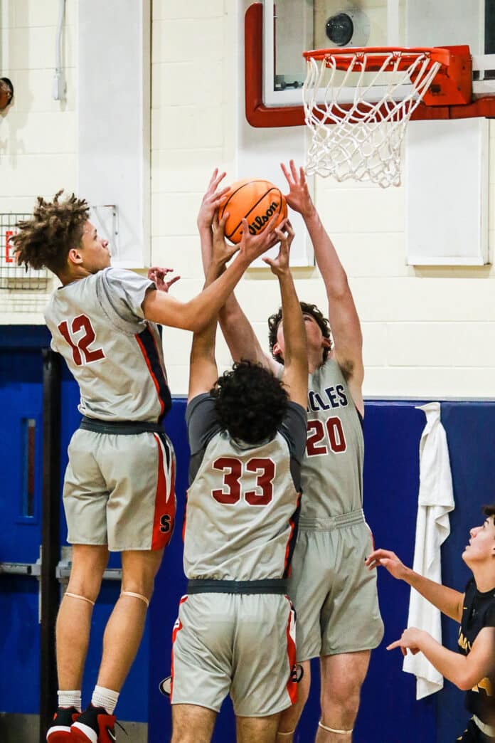 All hands on the ball Springstead Eagles #20 Andrew Danchise, #33 Nick Cordero and #12 Austin Nicholson. Photo by Cheryl Clanton.