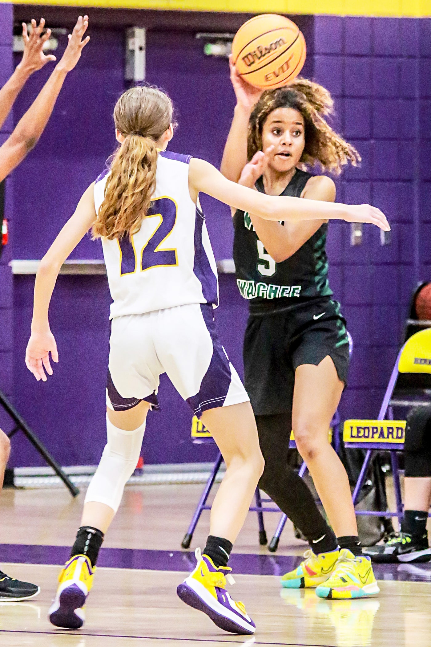 Weeki Wachee Senior #5 Joelysee Morales passes the ball with a pack of Leopards around her. Photo by Cheryl Clanton.