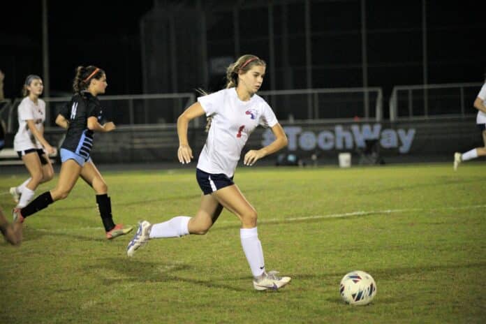 Springstead Lauren Anderson runs the ball up field SHS vs NTC 12/14 By Hanna Fox.