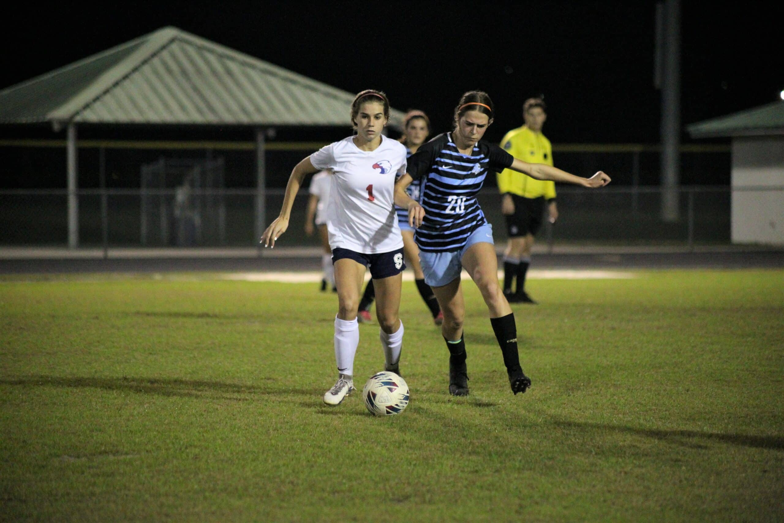 Springstead Lauren Anderson fights opponent for possession of the ball SHS vs NTC 12/14 By Hanna Fox.