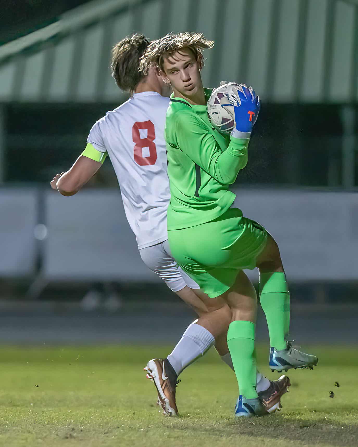 Nature Coast keeper , Cole Pretorius, snatches a loose ball away from the advance of Springstead’s Murphy Anderson, 8 Friday at NCT. Photo by JOE DiCRISTOFALO