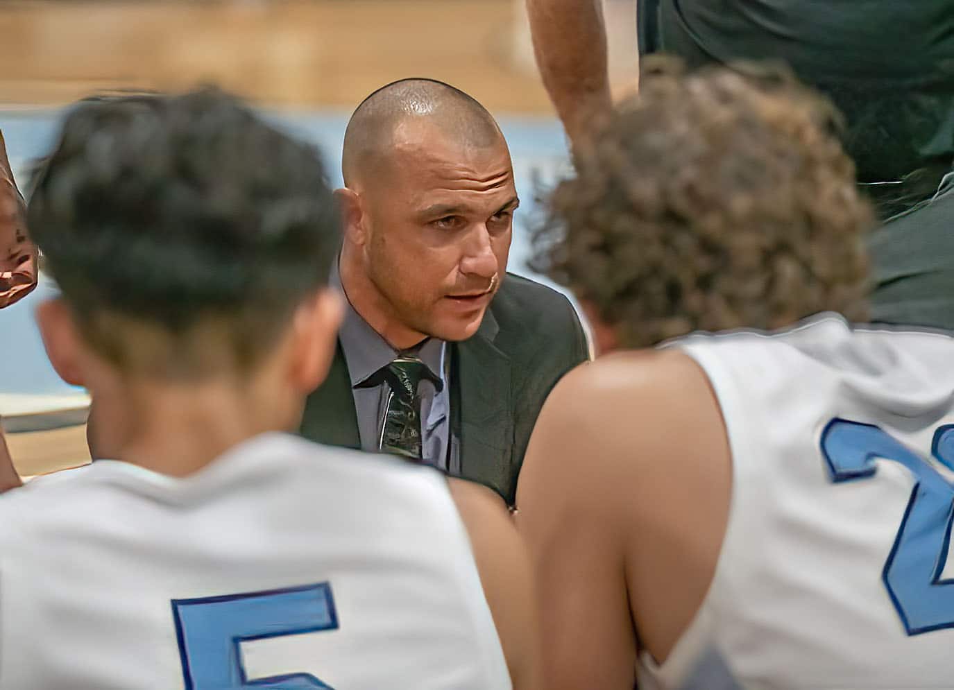 Nature Coast Tech Head Coach, David Piscarcik, confers with his team during a time-out Tuesday in the game against visiting Hernando High. Photo by JOE DiCRISTOFALO