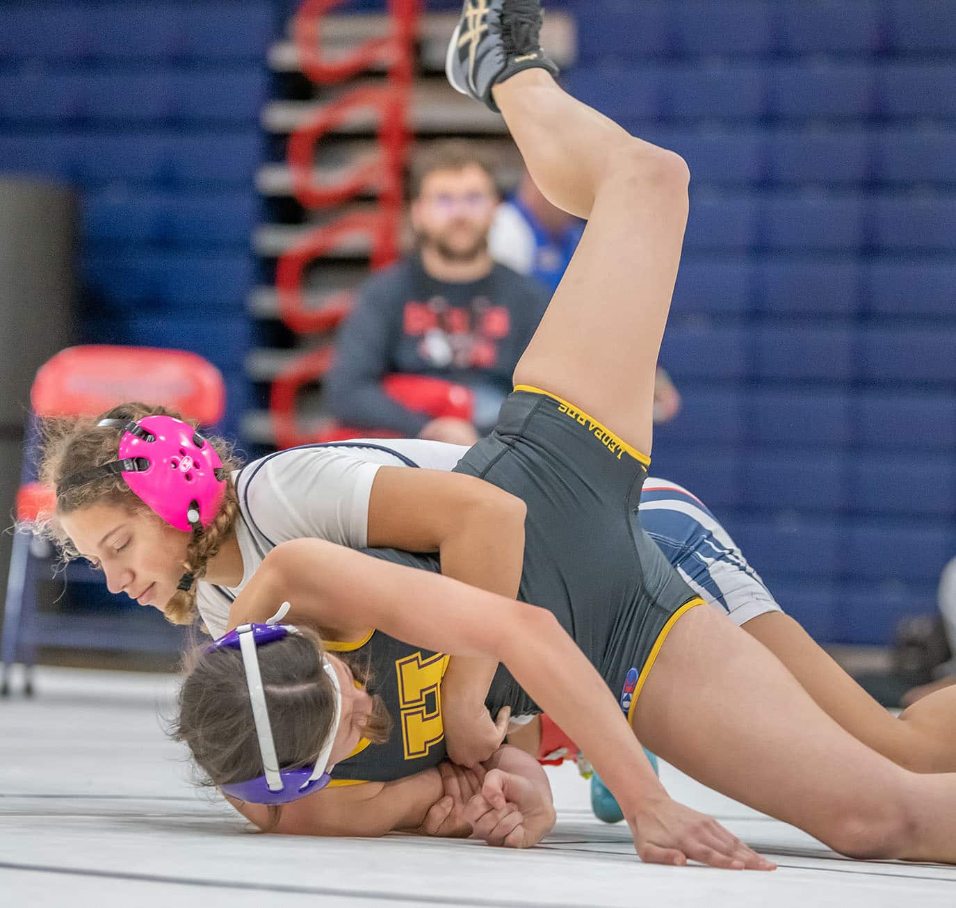 Springstead High, Jasmine Serrano takes down Elissa Rice from Hernando High in the 120 pound weight class. Photo by JOE DiCRISTOFALO