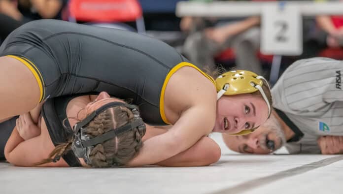 Hernando High 125 pound, Daniela Espinal,top, waits for the pin signal in her win over Alycia Rivera from Citrus High. Photo by JOE DiCRISTOFALO