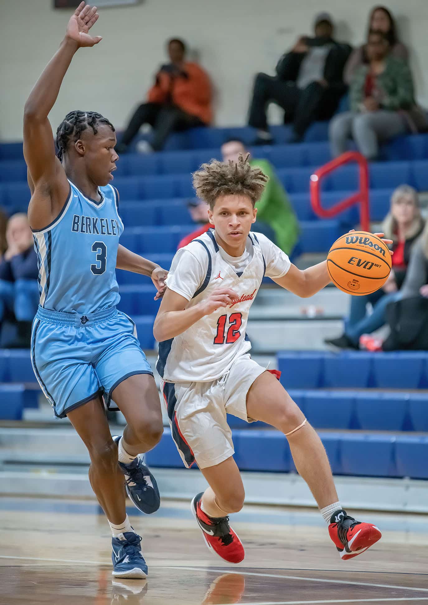 Springstead High,12, Austin Nicholson looks for a path to the basket while guarded by Berkely Prep ,3, George Kimble Wednesday in the 8th Annual Greg O’Connell Shootout at Springstead High. Photo by JOE DiCRISTOFALO