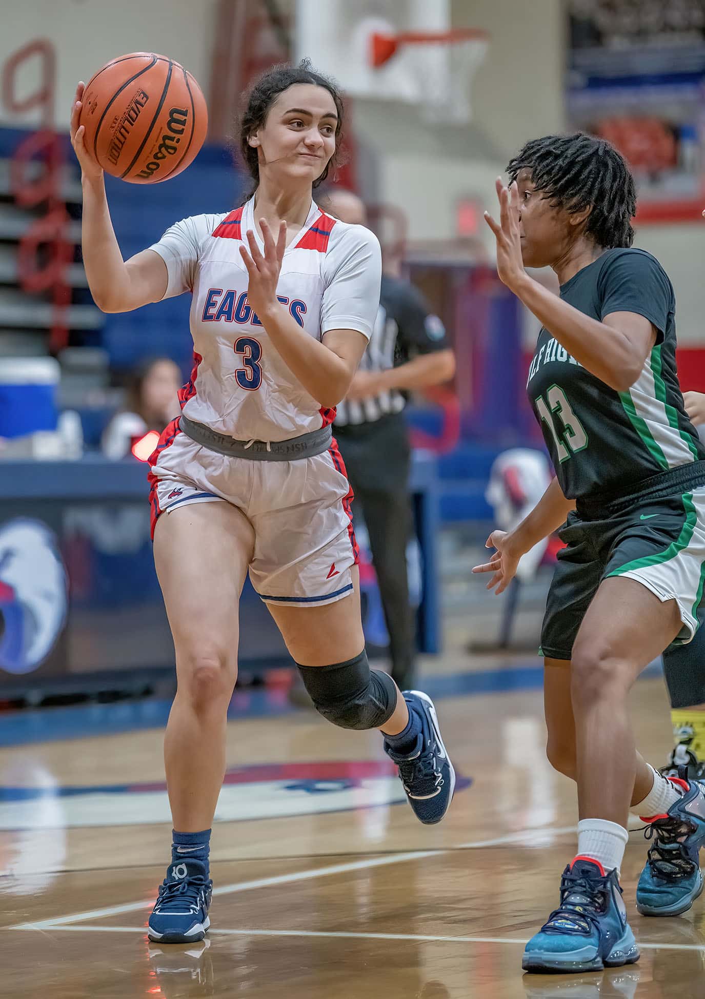 Springstead Brianna Greene ,3, passes the ball in the game versus Gulf High while defended by ,13, Brenniyah Hall Wednesday during Springsteads Holiday Tournament. Photo by JOE DiCRISTOFALO