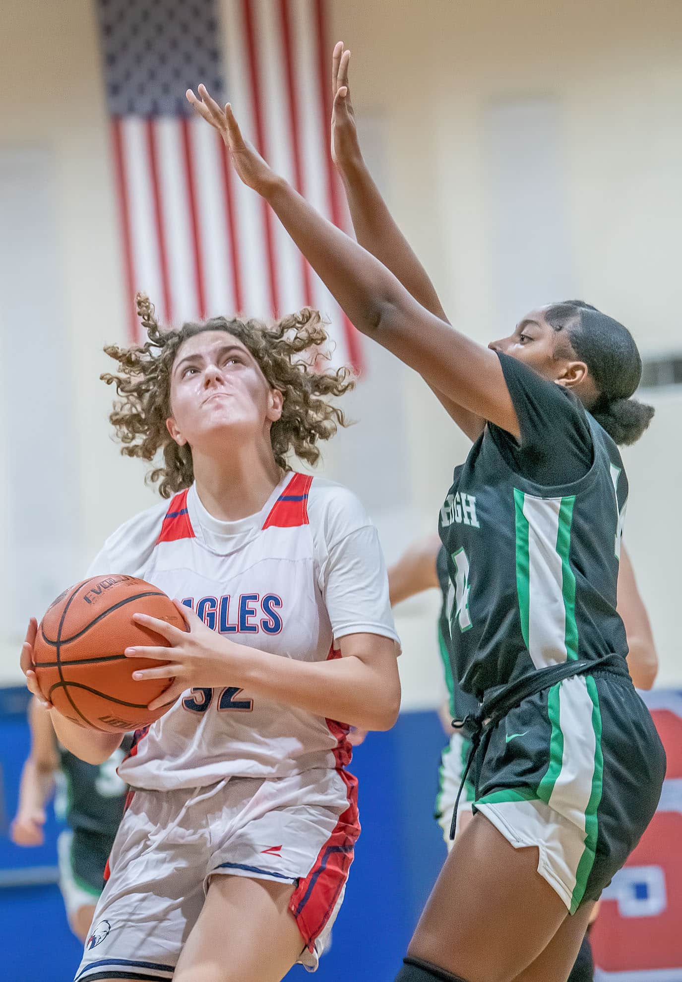 Springstead , 32, Addy Osborne works under the basket to get a shot against Gulf High’s ,14, Ania Butler Wednesday in the Springstead Holiday Tournament. Photo by JOE DiCRISTOFALO
