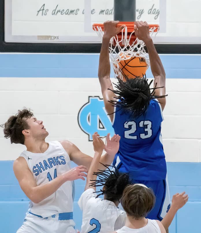 Sebring High ,23, Sylvester Lewis added this exclamation point dunk to put his team up ten points over Nature Coast in the last minute of the Final Game of the Nature Coast Christmas Tournament. Photo by JOE DiCRISTOFALO