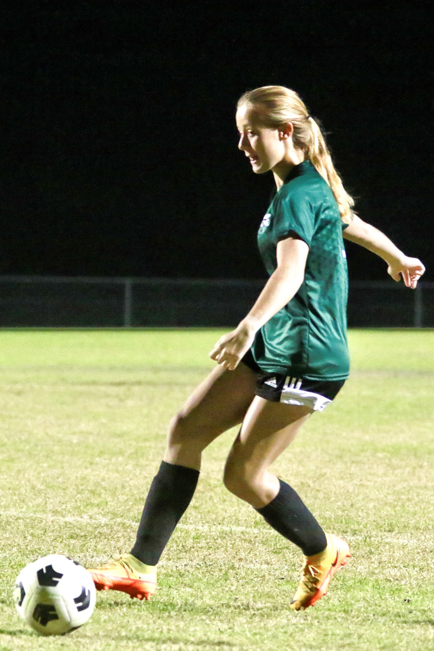 Wednesday night 12/7/22, HHS vs WW Girls Soccer game. Hornet #7 Lola Northrop warming up before taking on the leopards.