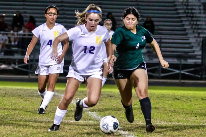 Hernando leopard #12 and Hornets # 4 Lesly Palacios battle to get control of the ball Wednesday night at Weeki Wachee.