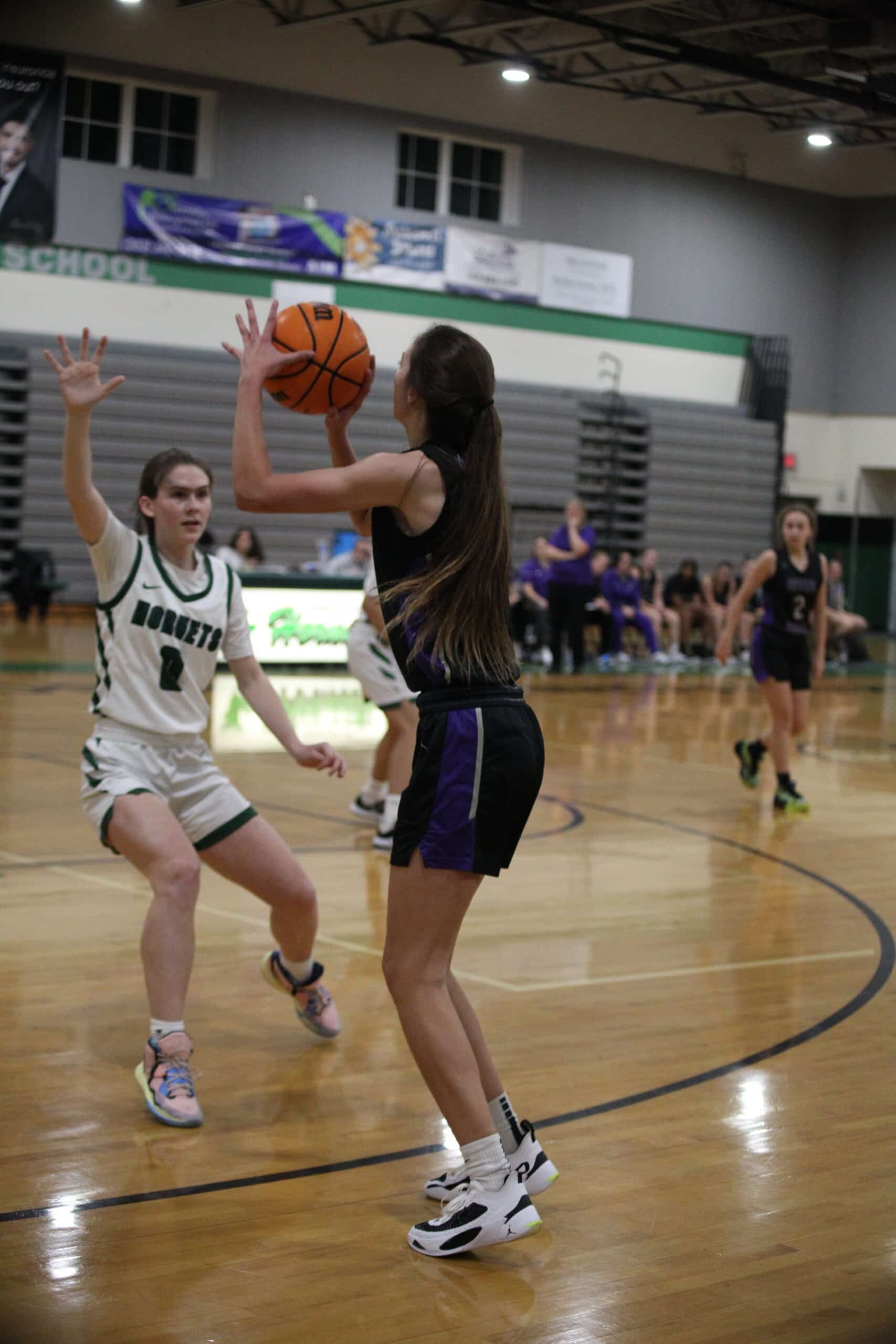 Hornet Reese Halter (So.) No. 0 attempts to defend against the shot from River Ridge. Jan. 4, 2023 Photo by Hanna Fox.