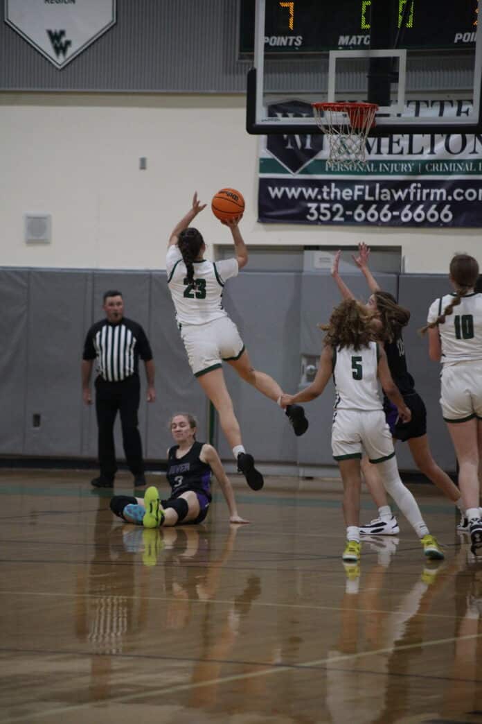 Weeki Wachee Junior Linsey Orr jumps for the shot against River Ridge Jan. 4, 2023. Photo by Hanna Fox.