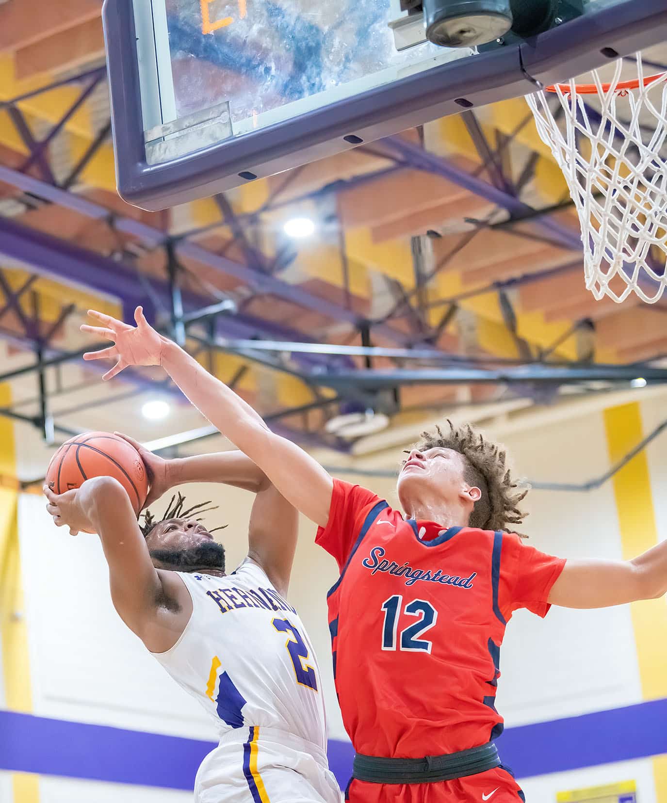 Hernando High ,2, R.J. Wilson elevates to put up a shot while defended by Springstead ,2, Quinn Lenamon Tuesday 1/3/23 at Hernando High. Photo by JOE DiCRISTOFALO