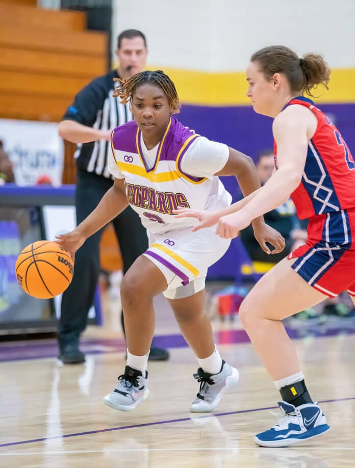 Hernando High, 3, Aaleyah Adams drives past Springstead High, 21, Lucy Waggoner Tuesday night 1/3 at Hernando High. Photo by JOE DiCRISTOFALO