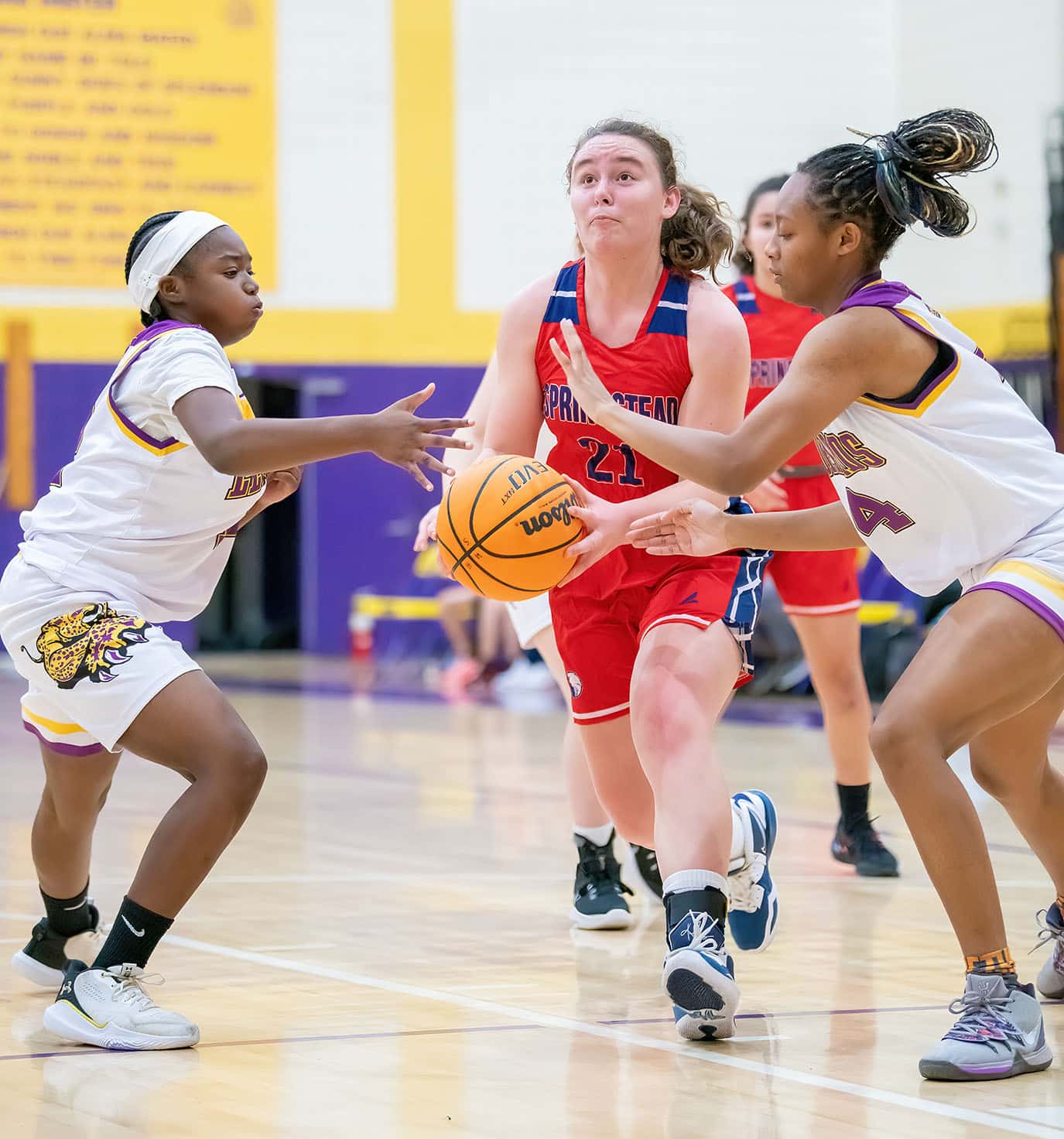 Hernado High, 12, left, Keke Gaines and ,4, Kayla Holloman team up to impede Springstead High, 21, Lucy Waggoner’s attempt at a basket. Photo by JOE DiCRISTOFALO