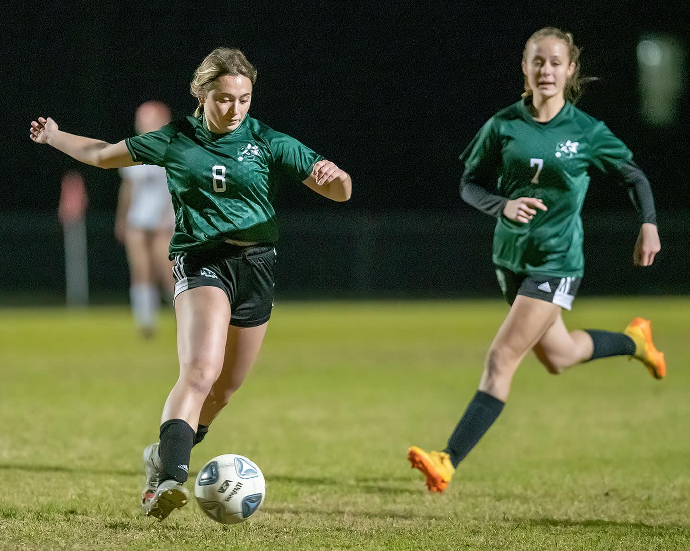 Weeki Wachee ,8, Monica Bierwith makes sure to clear a loose ball during the game with Springstead. Lola Northrup ,7, follows the play. Photo by JOE DiCRISTOFALO