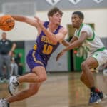 Hernando High, 1o, Michael Savarese goes hard around the defense by Weeki Wachee, ,24, Anthony Wilson Tuesday 1/24/23 in Brooksville. Photo by JOE DiCRISTOFALO
