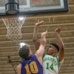 Weeki Wachee High, 14, goes over the defense by Hernando High, 10, Michael Savarese Tuesday 1/24/23 at Weeki Wachee High. Photo by JOE DiCRISTOFALO