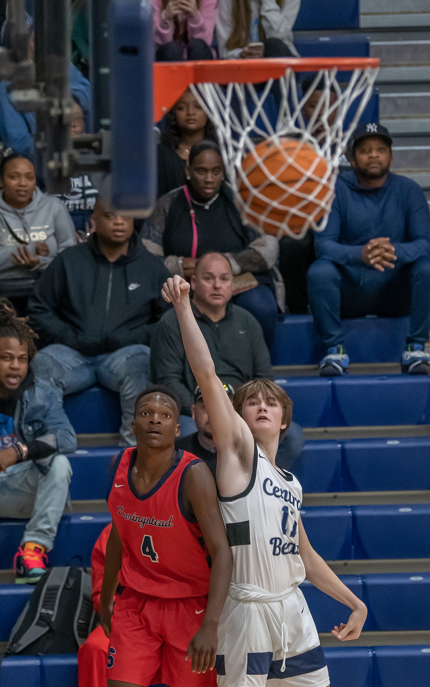 Springstead High, 4, Caidell Gilbert and Central High, 11, Ethan Bergantino watch Bergantino’s three point shot Friday at Central High. Photo by JOE DiCRISTOFALO