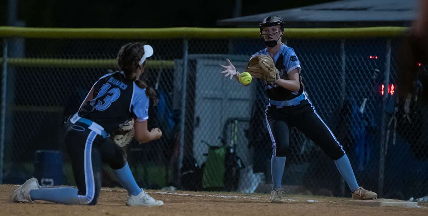 Nature Coast first base,13, Kassie Figueroa underhands the ball to Haley Keane to record an out against visiting Weeki Wachee Tuesday. Photo by JOE DiCRISTOFALO
