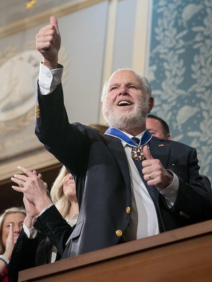 Rush Limbaugh gives a thumbs-up to President Donald J. Trump from the House Gallery Tuesday evening, Feb. 4, 2020, after President Trump awarded Limbaugh with the Medal of Freedom during the State of the Union address at the U.S. Capitol in Washington, D.C. (Official White House Photo by D. Myles Cullen) Public Domain