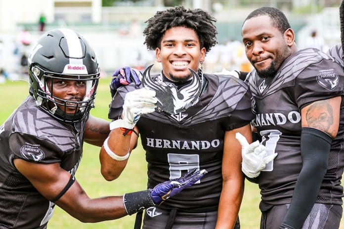 Saturdays game against the Bulldogs, Hawks #8 ATH Jamaya Clemmons made and wore the Hawks turn over chain. As #9 S Kaleb Browdy and #0 ATH Roderick Huff help Clemmons show it off.