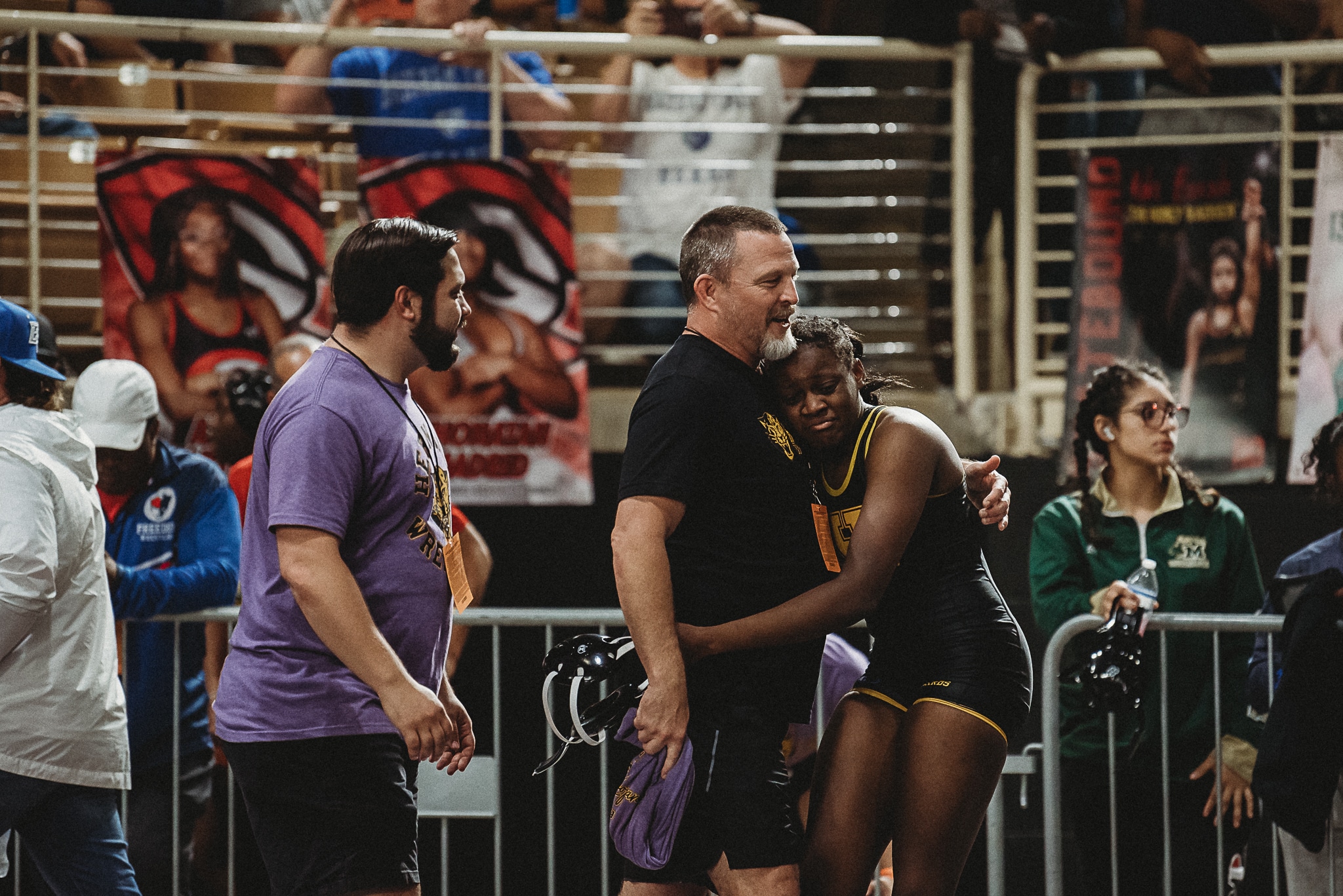 Olivia Brown hugs Coach Chance Phillips after earning a spot on the podium.