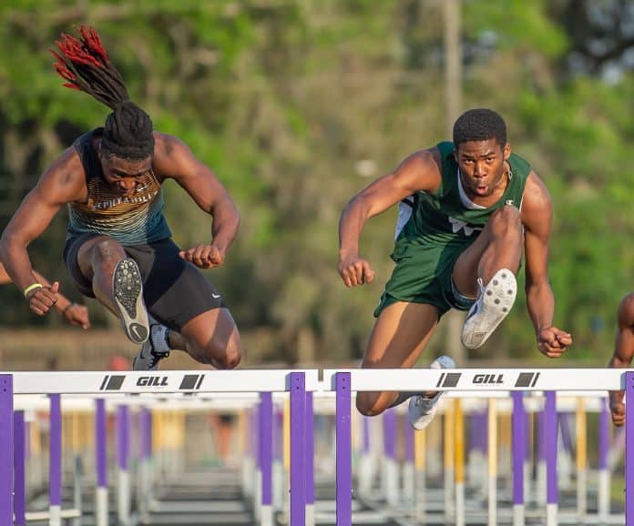 Weeki Wave High’s Anthony Wilson took first in the Mens 100 meter hurdles in the Kiwanis Invitational at Hernando High.  Photo by JOE DiCRISTOFALO