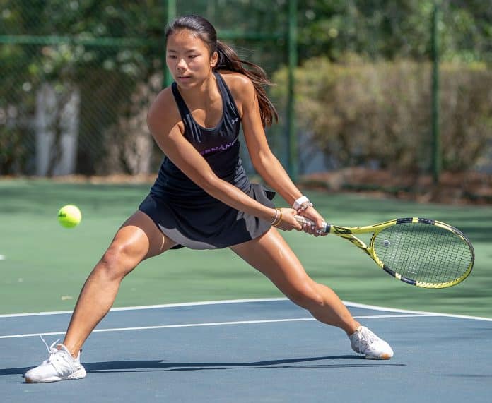 Hernando High’s Mia Liu concentrates on a backhand return in a doubles match versus Central High at Brooksville Park Tuesday afternoon. Photo by JOE DiCRISTOFALO