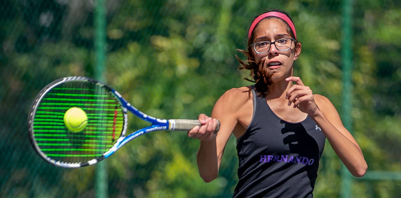 Hernando High’s Jackie Cuevas powers through a forehand return in a doubles match versus Central High at Brooksville Park Tuesday afternoon. Photo by JOE DiCRISTOFALO