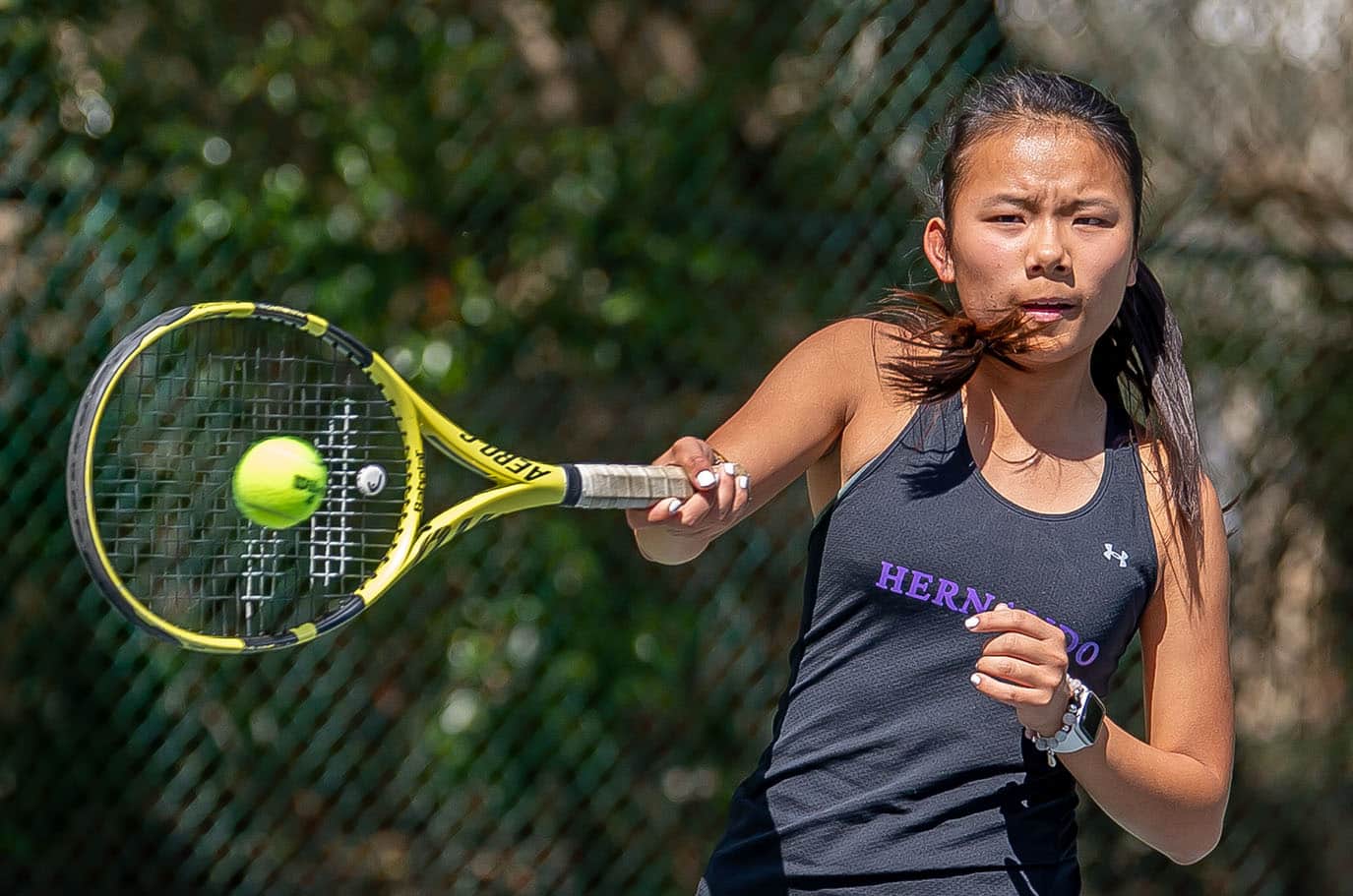 Hernando High’s Mia Liu handles a forehand return in a doubles match versus Central High at Brooksville Park Tuesday afternoon. Photo by JOE DiCRISTOFALO