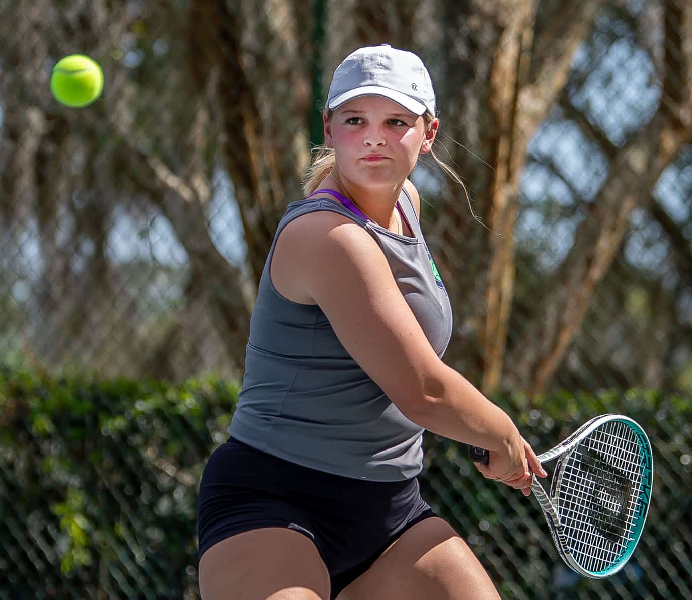 Central High’s Natalie Kupres zeroes in on a backhand in a doubles match with Hernando High Tuesday in Brooksville. Photo by JOE DiCRISTOFALO
