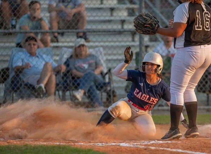 Springstead High’s, 42, Sarah Torres scores a run on a passed ball in the home game with Weeki Wachee High. Photo by JOE DiCRISTOFALO