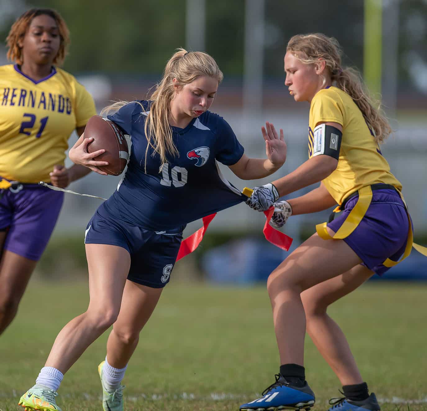 Springstead High’s, 10, couldn’t elude the tackle by Hernando High’s Kasee Grant Monday at Booster Stadium. Photo by JOE DiCRISTOFALO