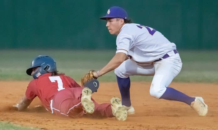 Hernando High shortstop ,22, Drew Vanalstine looks to the umpire for the out call which erased Springstead high’s ,7, Dalton Williams trying to stretch a hit into a double Tuesday in Brooksville. Photo by JOE DiCRISTOFALO