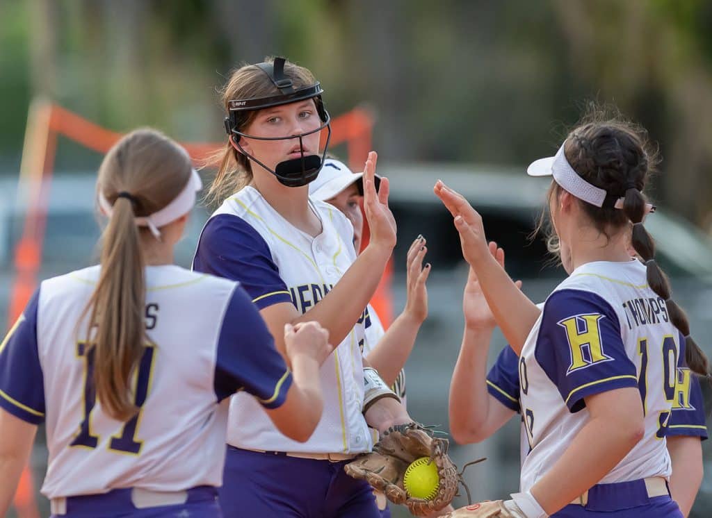 Hernando High’s Ava Braswell gets high fives from her teammates after a strike out versus Citrus High Wednesday, 4/19, at Tom Varn Park. She threw a complete game shut out with nine strikeouts. Photo by JOE DiCRISTOFALO