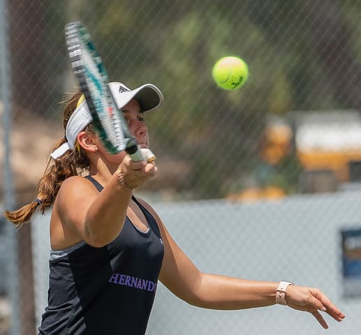 Hernando High's Annabelle Chamberlain concentrates on a return during the number 2 doubles final match against Lecanto High during Gulf Coast 8 conference championship held a Delta Woods Park. Photo by JOE DiCRISTOFALO