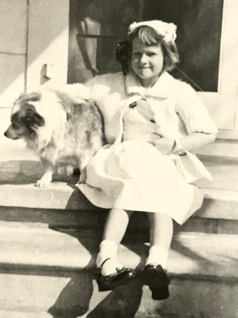 Judy all dressed up trying to get farm dog Mitzi to pose on Easter Sunday 1958. I don’t think Mitzi wanted to be a part of the scene.