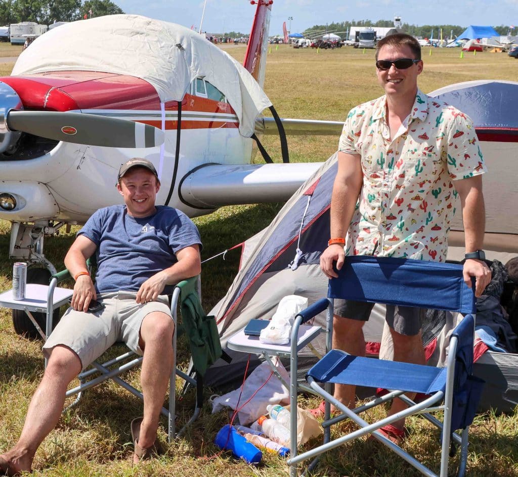 Brothers Tyler and Ryan Ferris enjoy the week camping with their plane. Photo credit: Mark Stone