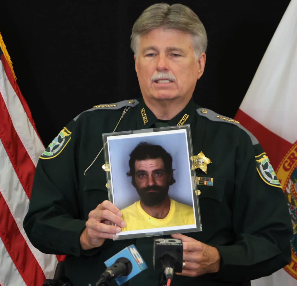 Sheriff Al Nienhuis displays a photo of murder suspect Jeffrey Norman Crum as he looked in1993 when he is alleged to have murdered Jennifer Odom. Photo: Mark Stone/FMN