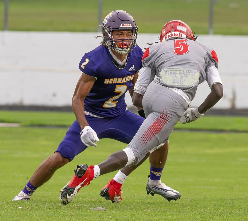 Gabe Sasone, 2, Hernando High safety lines up an open field tackle on Clearwater High’s ,5,Michael Jelks. Photo by JOE DiCRISTOFALO