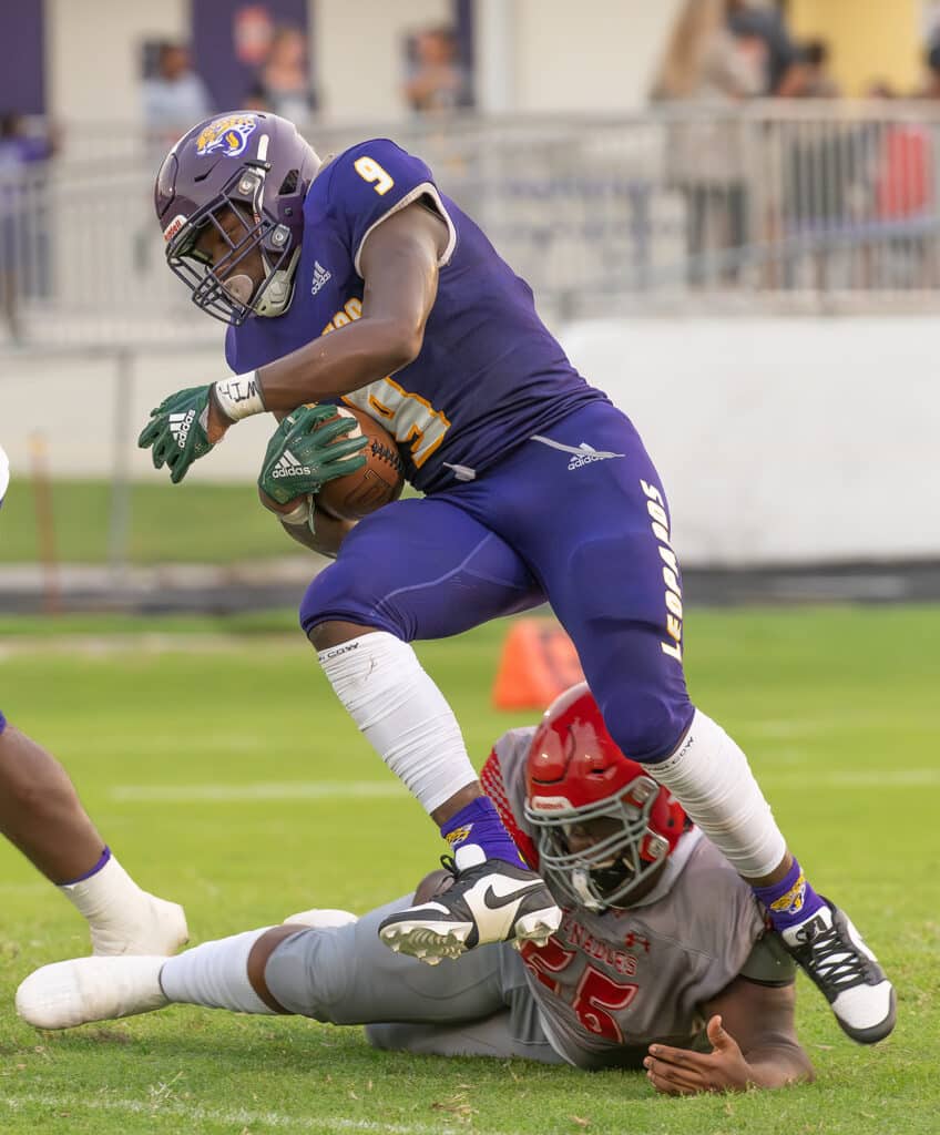 Hernando High’s ,9, John Capel III, evades a tackle during Friday nights preseason game with Clearwater High in Brooksville. Photo by JOE DiCRISTOFALO